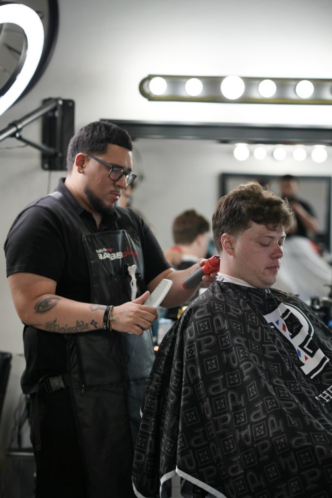 Taper fade haircut by JoJo at The Parlor Barbershop